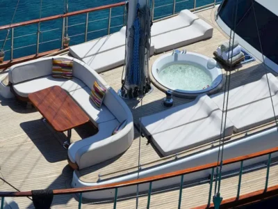 Ekmar Yachting Blue Heaven Gulet Yacht Anchored In Bay Bow Sun Deck Jacuzzi Sofa Bow View 400x300